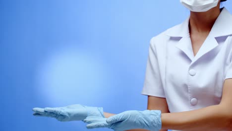 a nurse forms a heart, love symbol, with her hands and fingers then displays copy space for your message