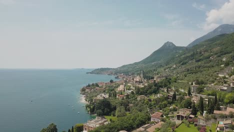 iconic mediterranean houses of gargnano in front of lake garda coastline