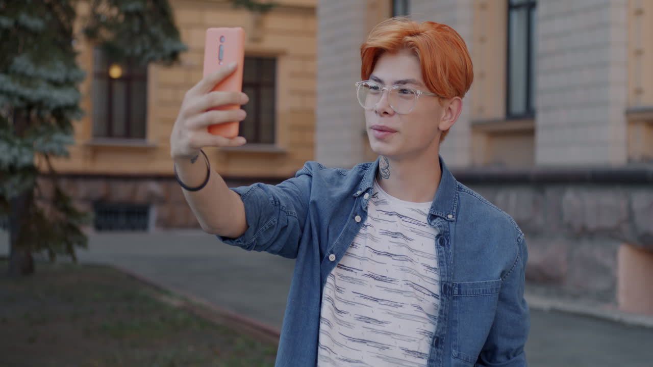 Young Man Taking a Selfie in the City