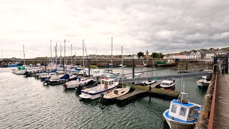 boats docked in a scenic harbor