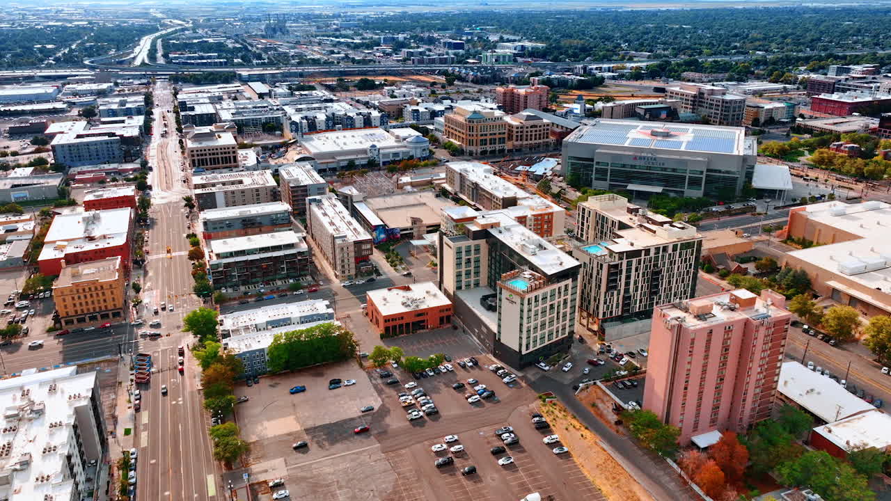 Salt Lake Sity USA, 14 August 2025: Flight over the multi-storied buildings of Salt Lake City, Utah, USA. Long highway with hectic traffic at backdrop
