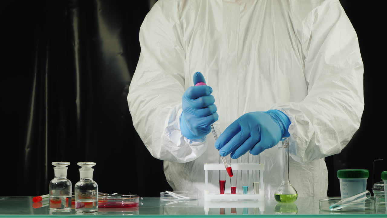 Technician drop blood in test tube