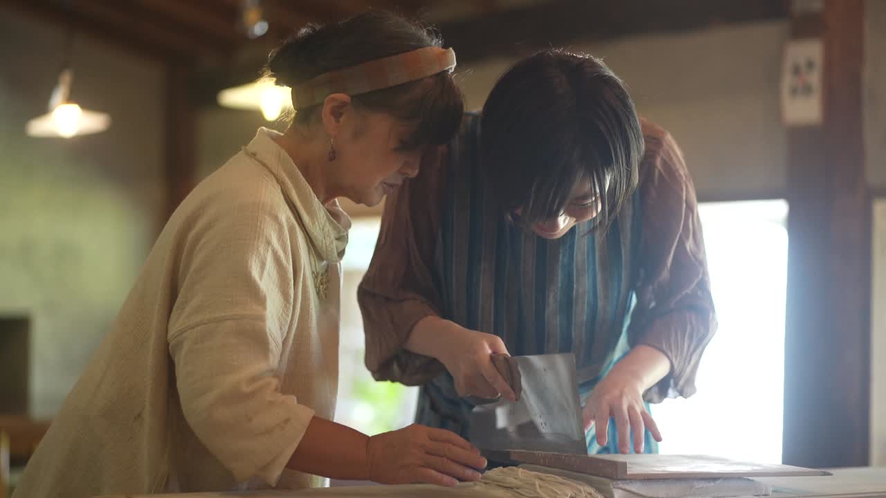 Woman making buckwheat noodles