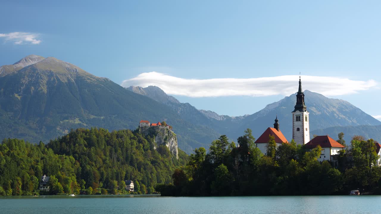 Tranquil Bled Island view, serene mood with mountains in the backdrop