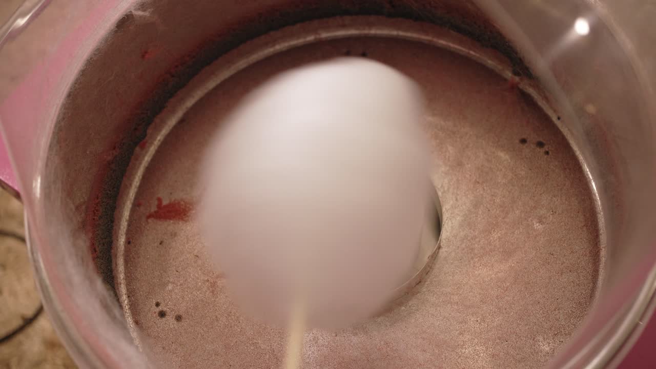 Cotton candy forming inside machine close up