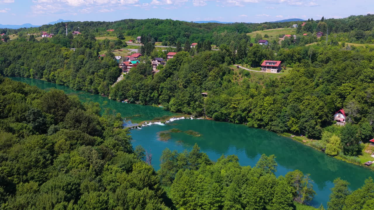 Travertine Waterfalls At Mrežnica River Along The Picturesque Town Of Duga Resa In Croatia. Aerial Drone Shot