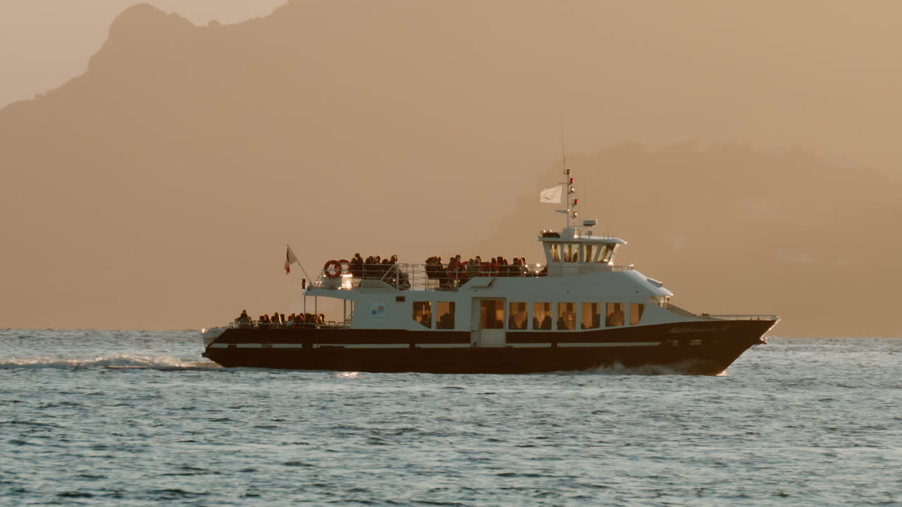 Boat moving on the sea in Cannes, France in the evening