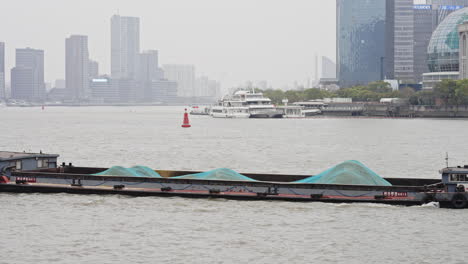 barge on huangpu river during covid 19 lockdown in shanghai, china