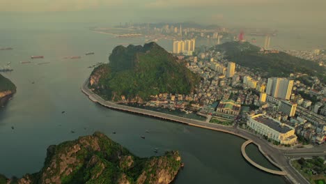 drone view of a city situated near halong bay in vietnam during sunset