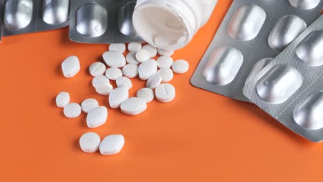 white pills and pill packaging