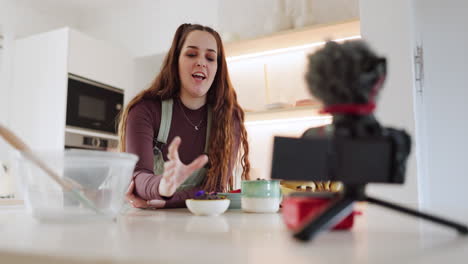 Woman,-camera-and-live-streaming-in-kitchen