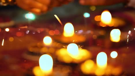 close-up of lit diwali diyas