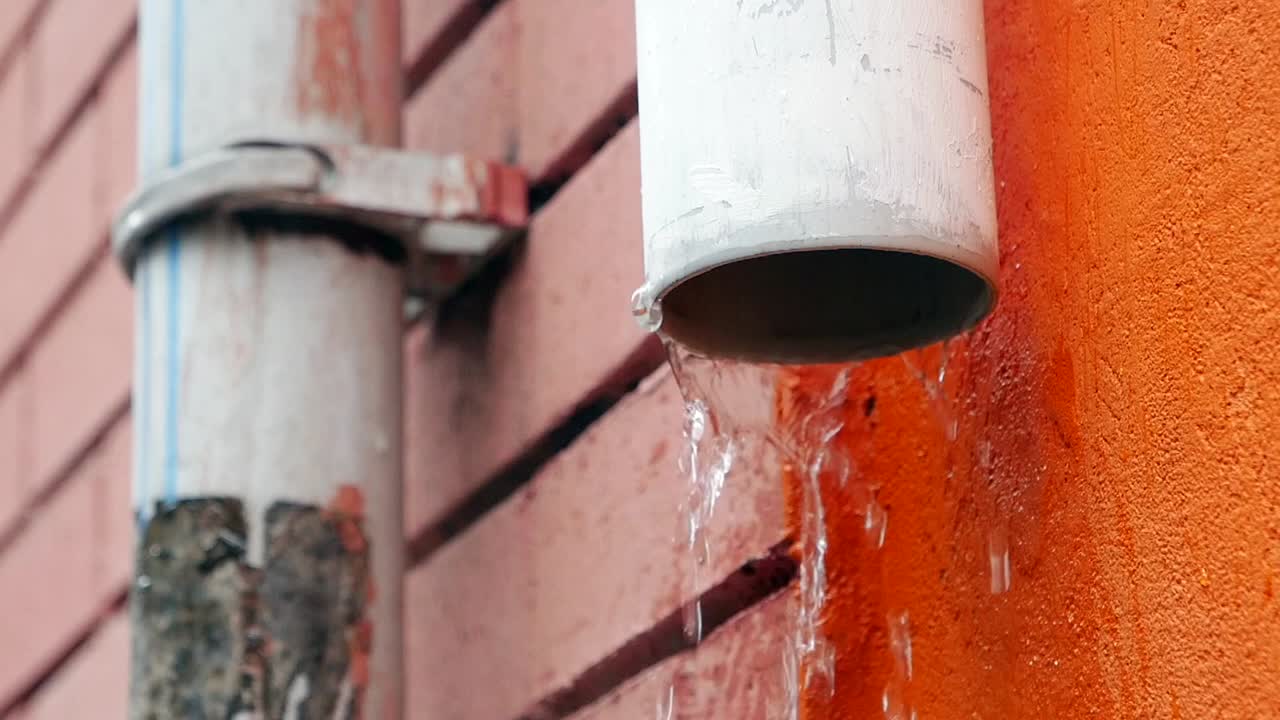 Water Dripping from Rain Gutter