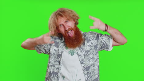 happy man showing rock n roll gesture by hands cool sign crazy expression dancing victory win
