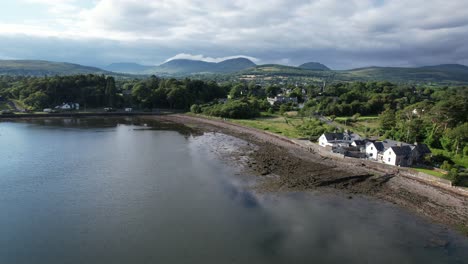 cottages on edge of kenmare bay county kerry ireland drone aerial view