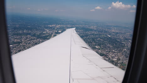 The-Airliner-Begins-To-Land-Over-New-York-A-Spectacular-View-Of-The-City-In-The-Foreground-The-Wing-