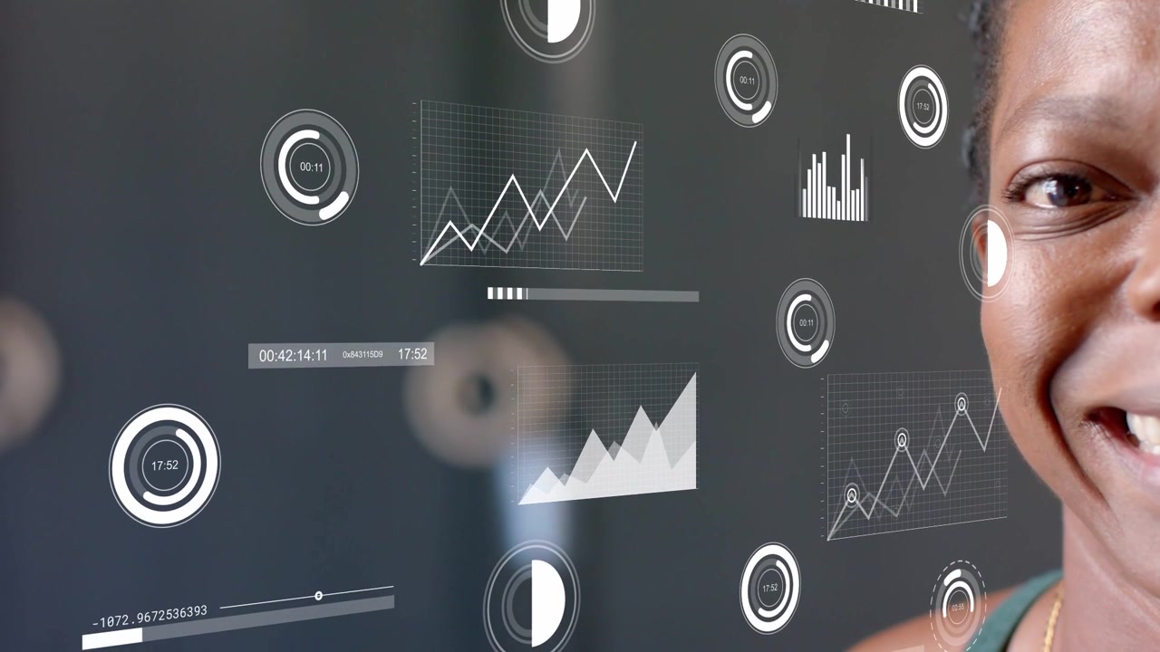 Woman standing at right edge monitoring HUD gauges and charts updating with analytics data, smiling