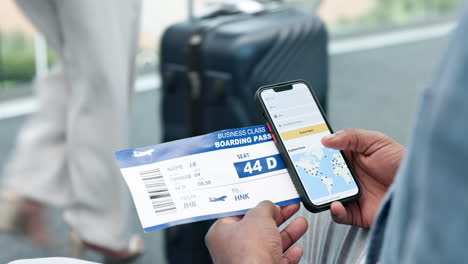 Phone,-screen-and-hand-with-ticket-for-travel