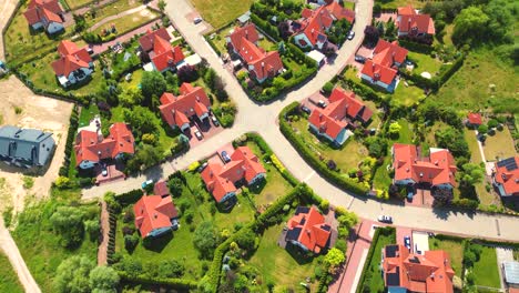 Aerial-view-of-residential-houses-neighborhood-and-apartment-building-complex-at-sunset