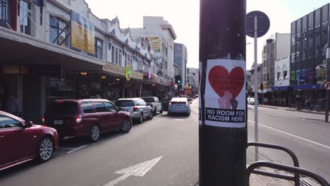 slow shot of sign for national unity against fascism after tragedy.
