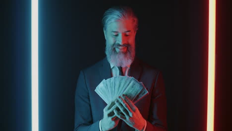 businessman excited about money in neon light