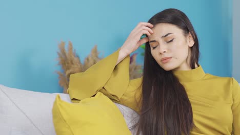 Unhappy-depressed-young-woman-is-overwhelmed-and-thinking.