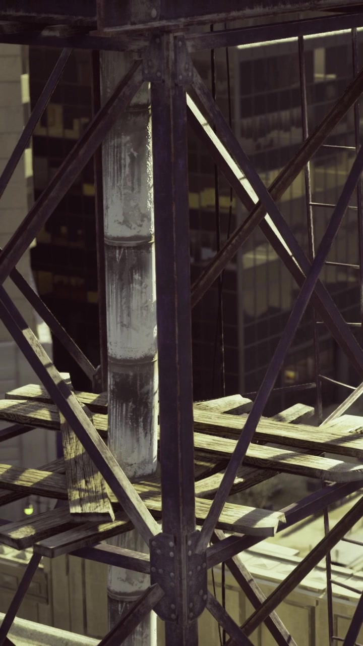 Construction site in a city with metal structure and wooden planks at night