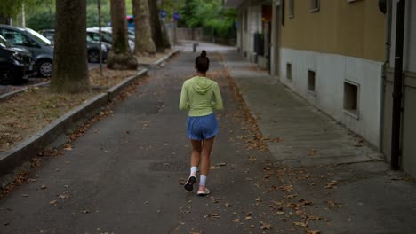 woman jogging in a city street