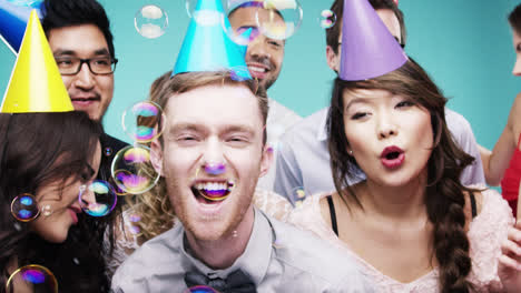 Multi-racial-group-of-happy-people-dancing-with-bubbles-slow-motion-party-photo-booth