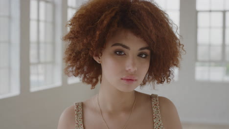 portrait-of-young-beautiful-woman-looking-serious-at-camera-cute-mixed-race-female-student-afro-hairstyle