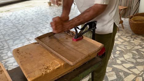 grip the wooden plate to carve and polish the handmade manmade home-made wood artisan as carpenter contemporary art skill of woodworking workshop in middle east asia gilan decoration craft furniture