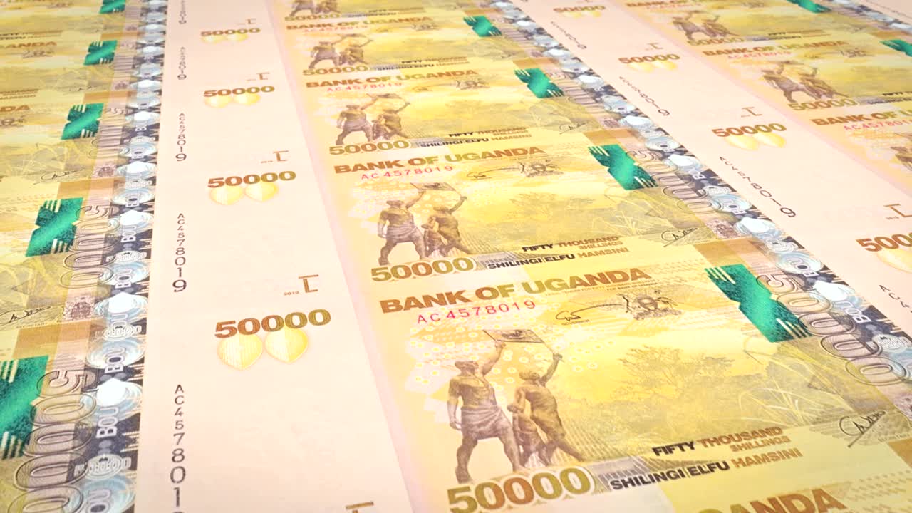 billetes de cincuenta mil chelines ugandeses de uganda, dinero en efectivo, bucle