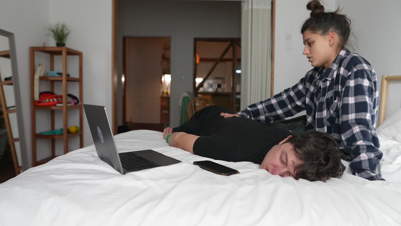 Couple Relaxing in Bed Watching Movie/Video Call