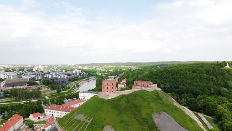 gediminas castle and vilnius township, aerial ascend reveal shot