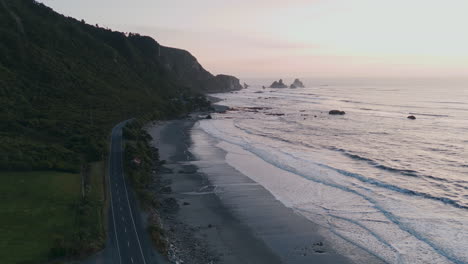 coastal road in new zealand at sunrise/sunset