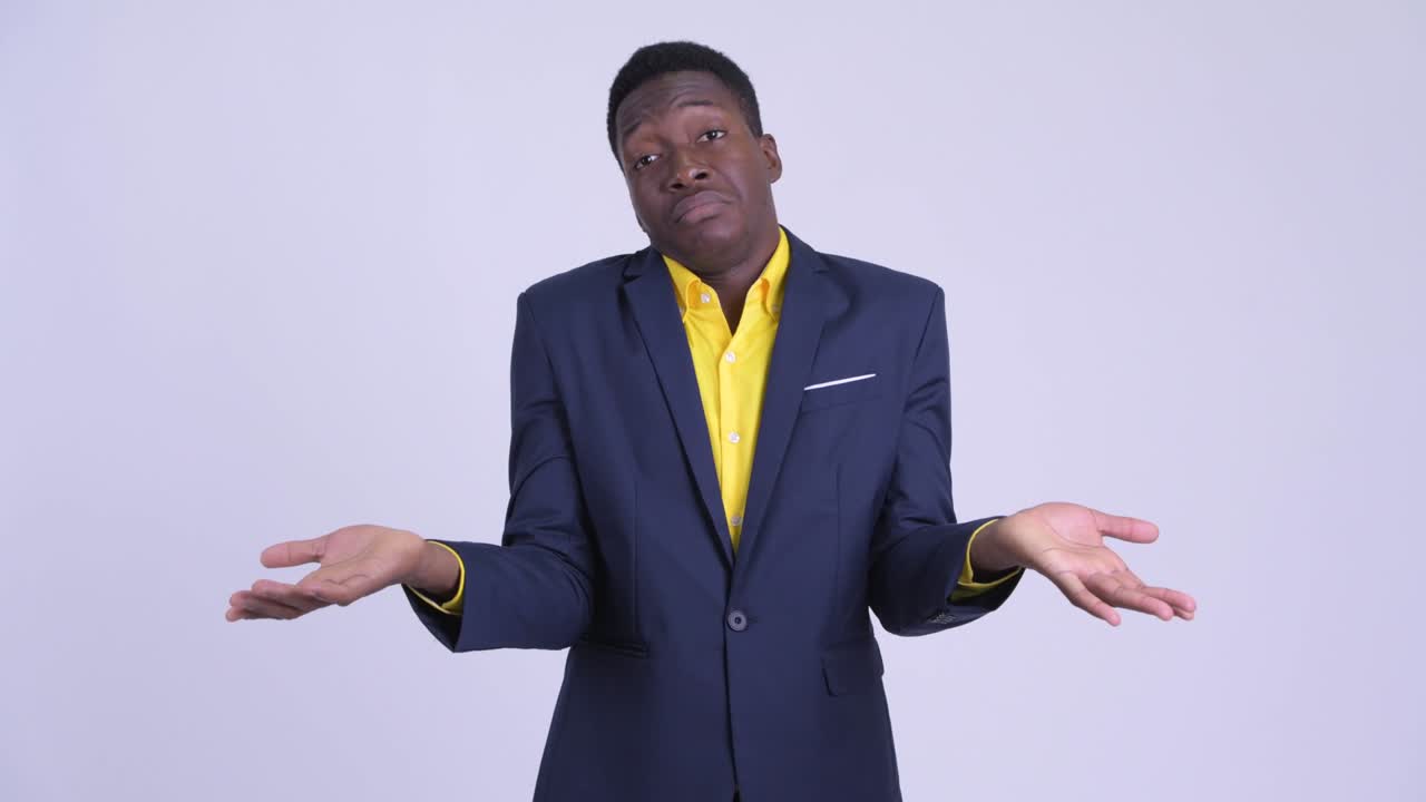 Young handsome African businessman in suit