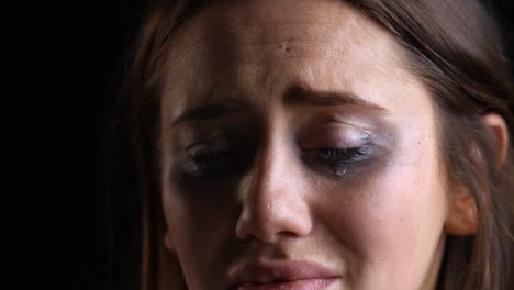 Studio-Portrait-Shot-Of-Crying-Woman-With-Smudged-Make-Up