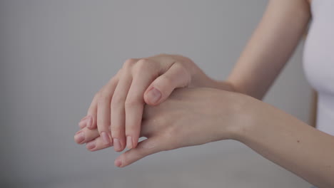 Detail-Of-A-Woman's-Hands-Applying-Cream-To-The-Hands