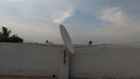 satellite antenna mounted on top of the village house.