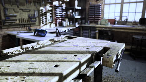 workshop interior featuring a weathered workbench and tools in bright light