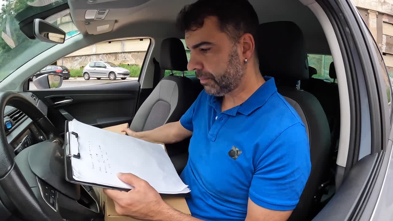 Car parked on the street with a delivery driver inside