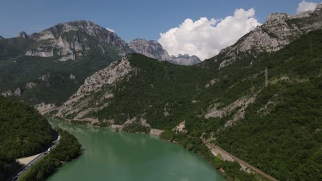 Drone-view-of-famous-Neretva-river-between-mountains,-river-with-greenery,-Bosnia-Mostar