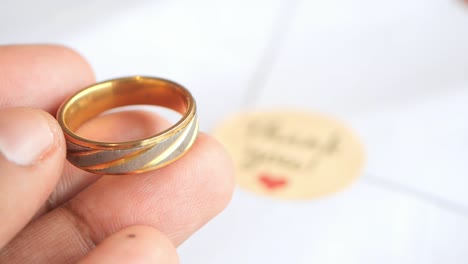 gold ring in hand