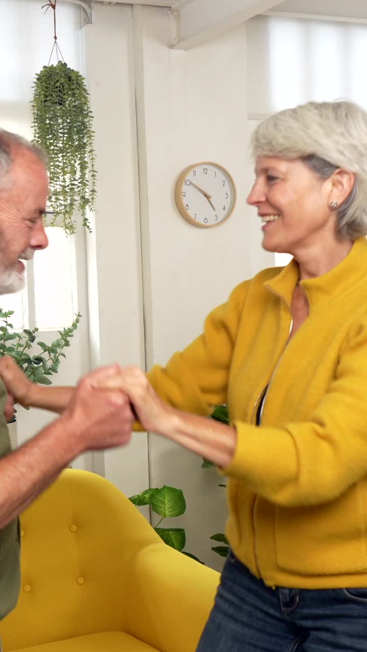 Senior Couple Dancing Together at Home