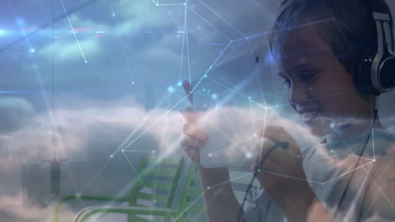 boy using smartphone and headphones in tech lounge, displaying animated network and node graphics