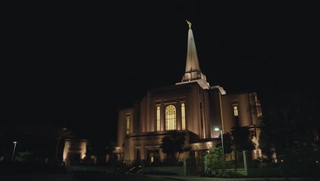 lds mormon temple church building at night illuminated by warm light in gilbert, arizona