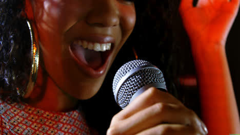 singer performing on stage at a concert 4k