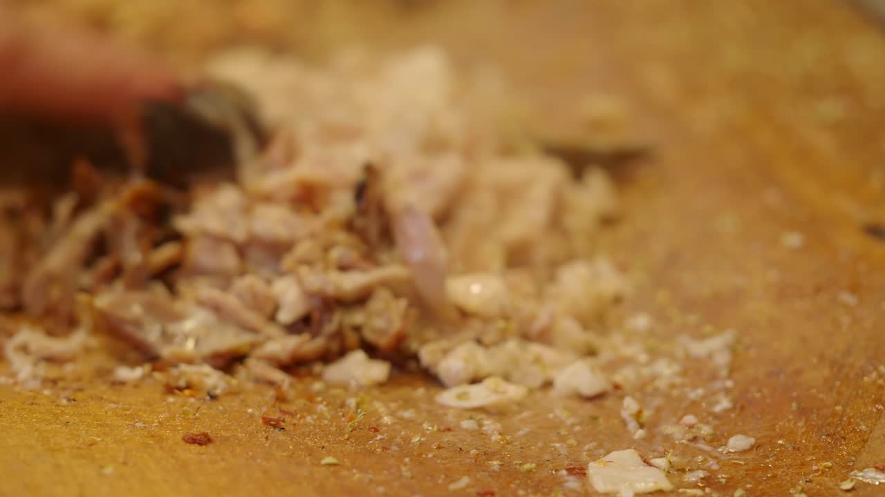 Chopping Meat on a Wooden Cutting Board
