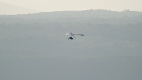 cinematic hang glider relaxed flight soaring telephoto