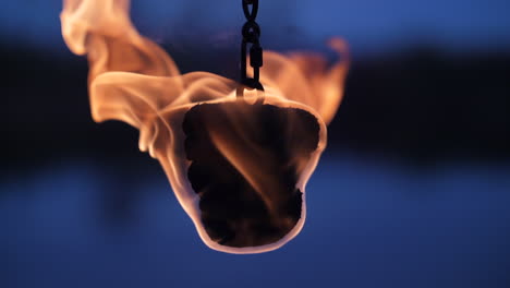 single fire poi dangling close up